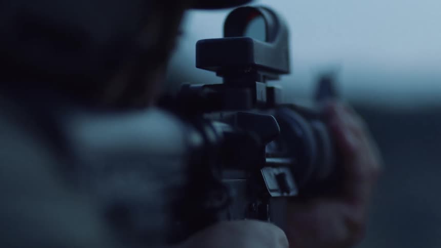 A person shooting a rifle