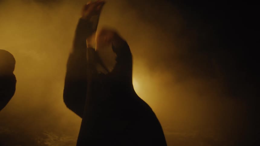 A dancer writhes about while trying to tear their way through hosiery