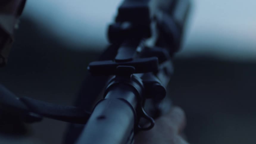 Man takes aim with military rifle
