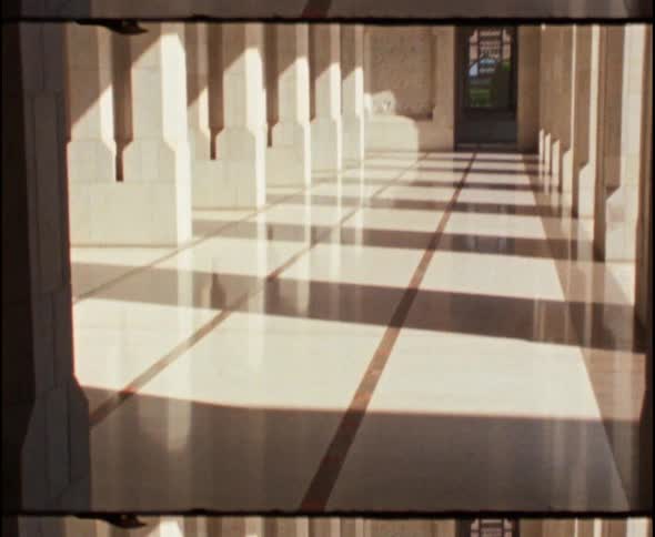 Film footage of an arched hallway
