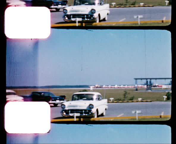 Cars parked in a parking lot at an airport