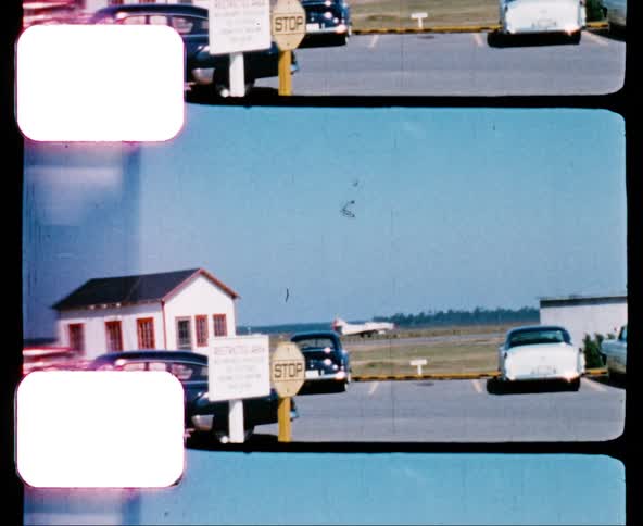 An airplane moving along the runway of a small airstrip