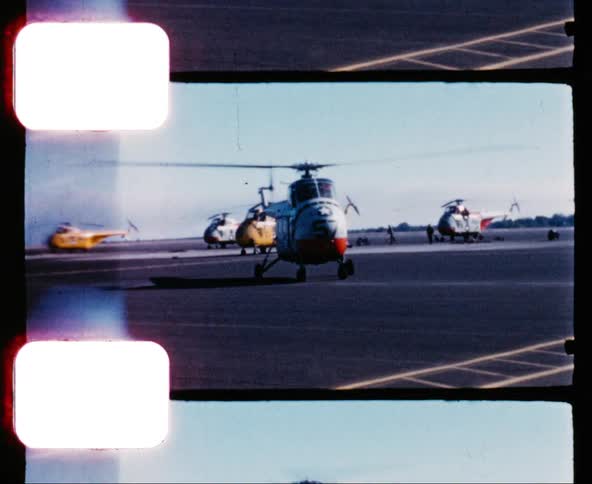 Vintage film reel of helicopter preparing to take off