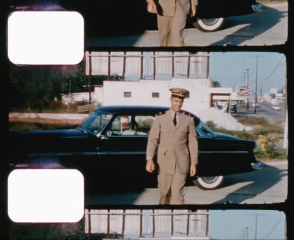 Man in military uniform gets out of the car