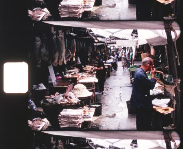 Asian people tend to outdoor stalls in a market