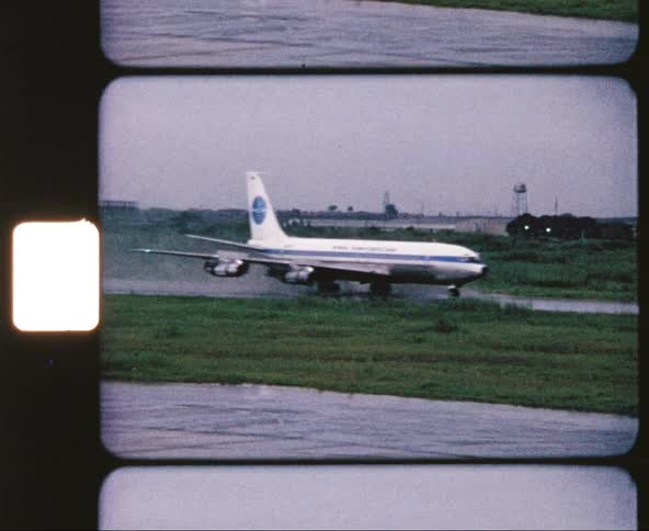 Plane landing in the runway while raining
