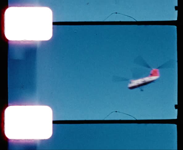 A military chinook helicopter flies through the sky