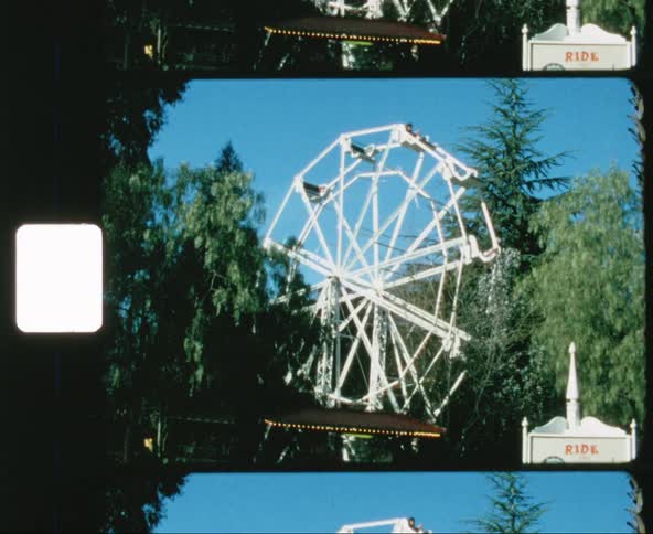 People ride a ferris wheel at a carnival