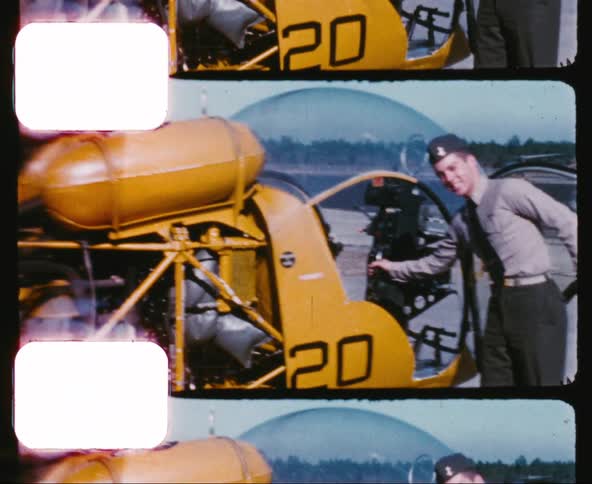 A man in a uniform next to a helicopter