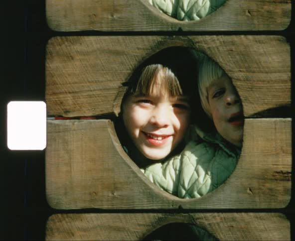 The kids stare out of a guillotine