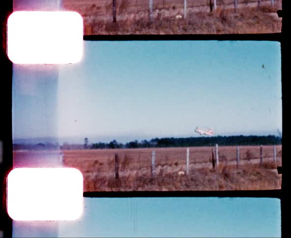 Helicopter landing on a field at day