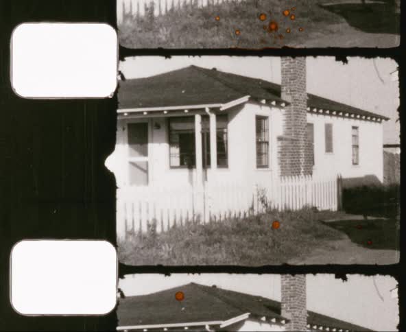 View of an old fashioned house surrounded by fence