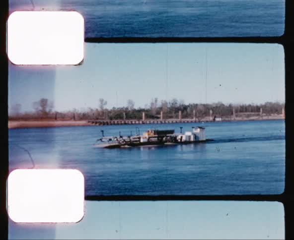 A barge floats down a river