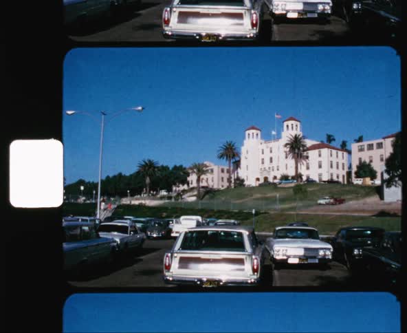 Zooming out from a building to a parking lot