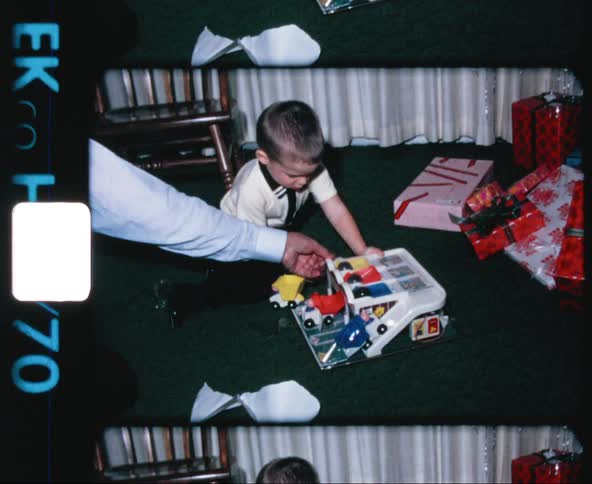 Father and son open presents in christmas morning