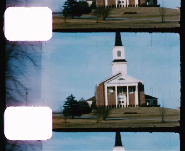 Vintage footage of church with steeple on a hill