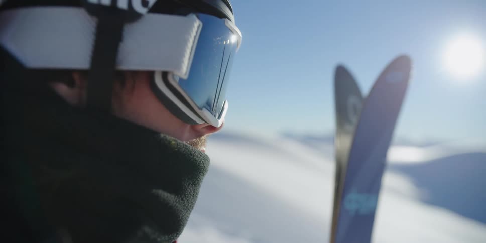 A skier looks out at the hill