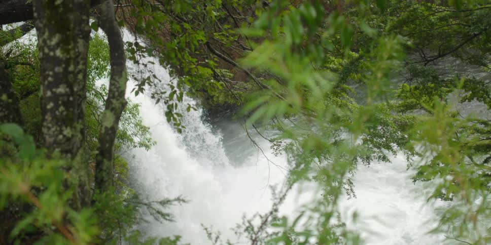 Waterfall above a lake in the woods