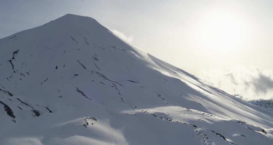 Aerial of a snowy volcano