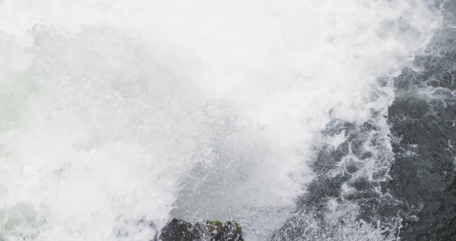 Aerial from above of the lip of a waterfall