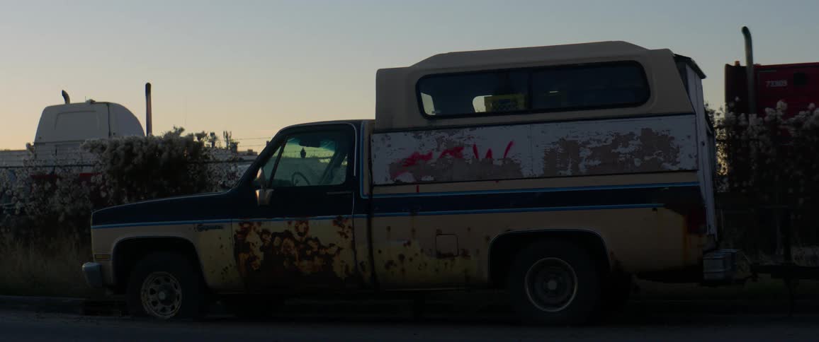 Rusted out pickup truck in junkyard
