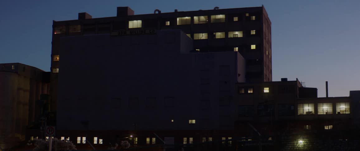 Illuminated building sits under the night sky