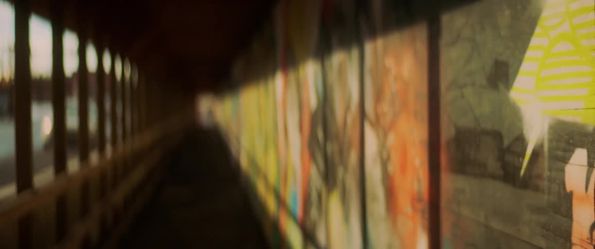 Sunlight lights up murals in a hallway