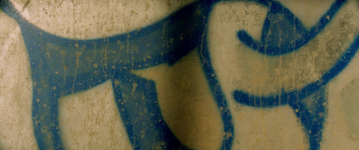 Graffiti on a stained wall