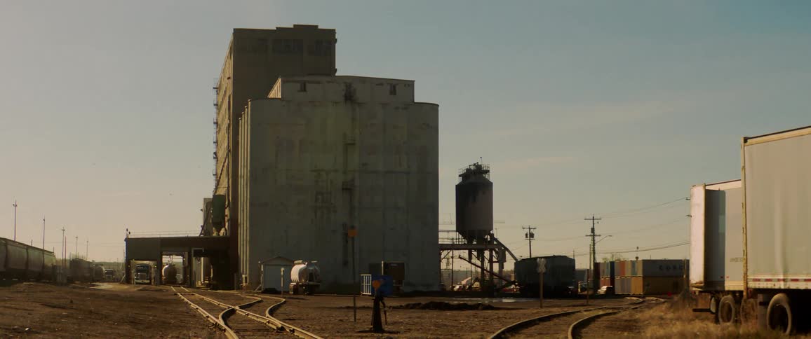 Train tracks outside a factory
