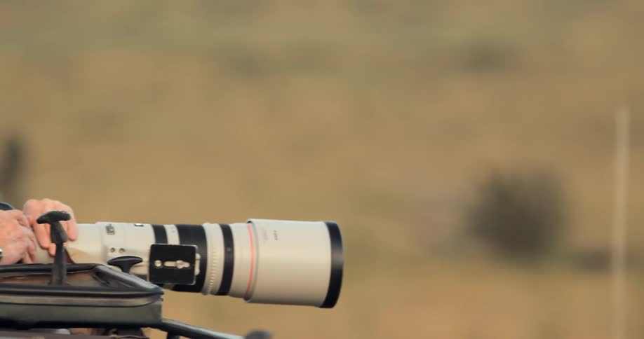 A man takes pictures with a large camera