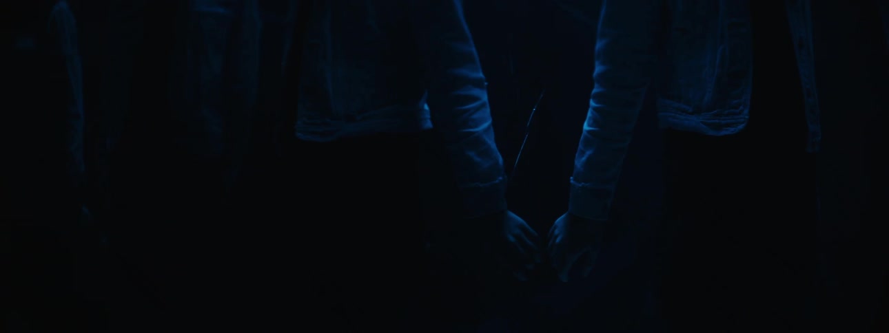 Woman and her reflection appear to be holding hands