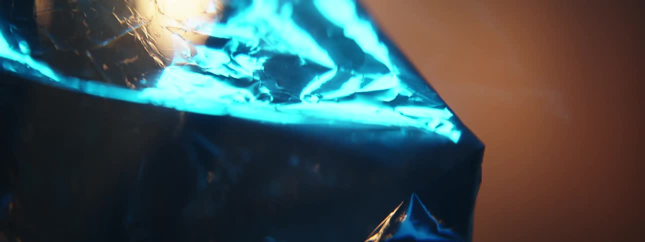 An square shiny object reflects blue and yellow light