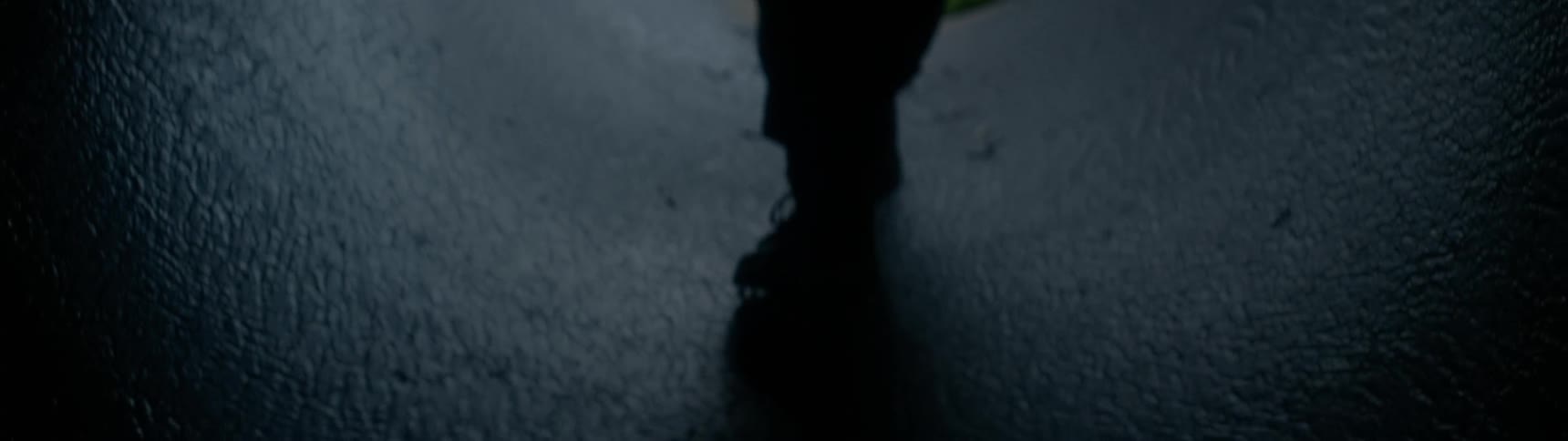 A person walks through a tunnel