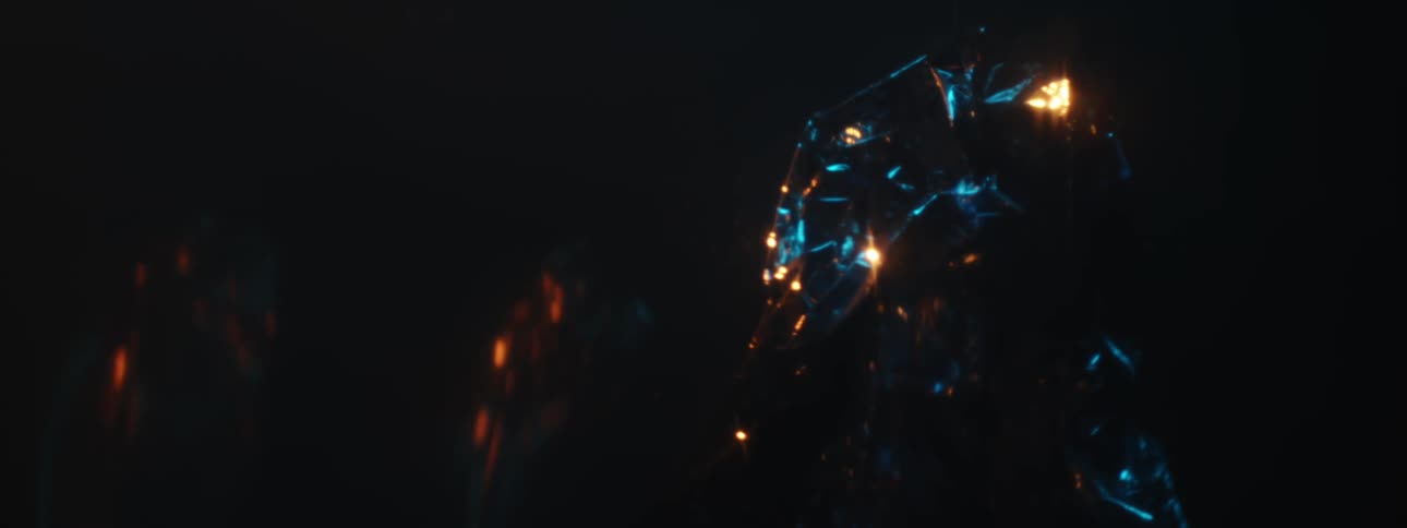 Objects with a crumpled surface lit up with blue and orange lights