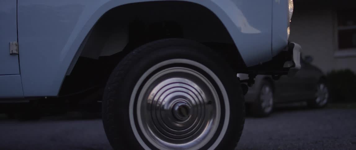 Classic pickup truck pulls into parking space