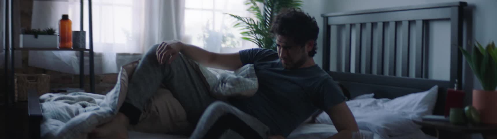 Man wakes up in the bedroom