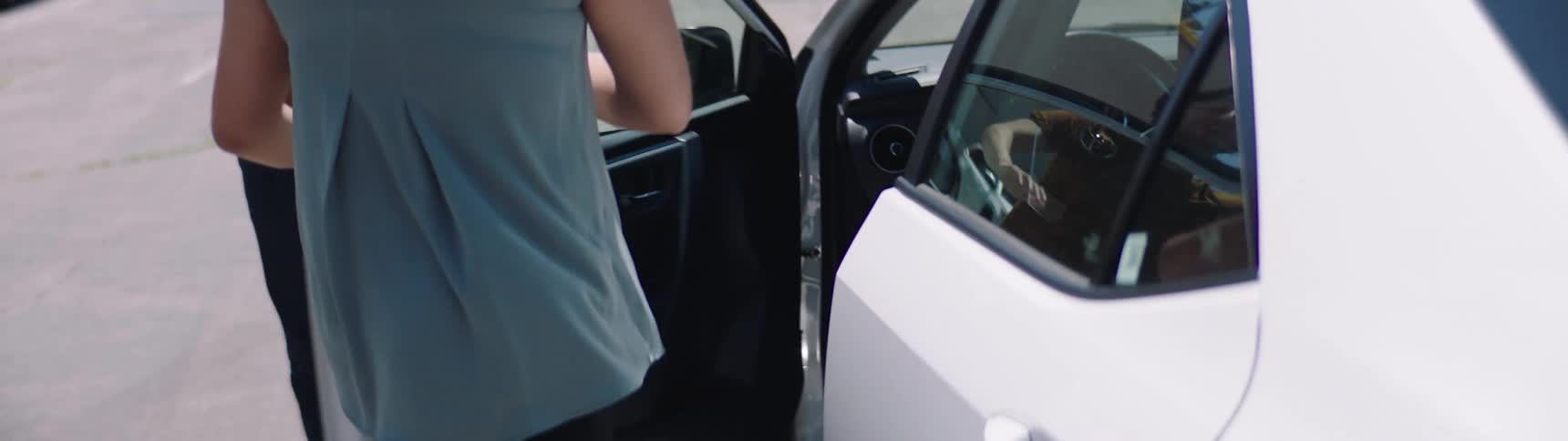 Man and woman fight in the parking lot