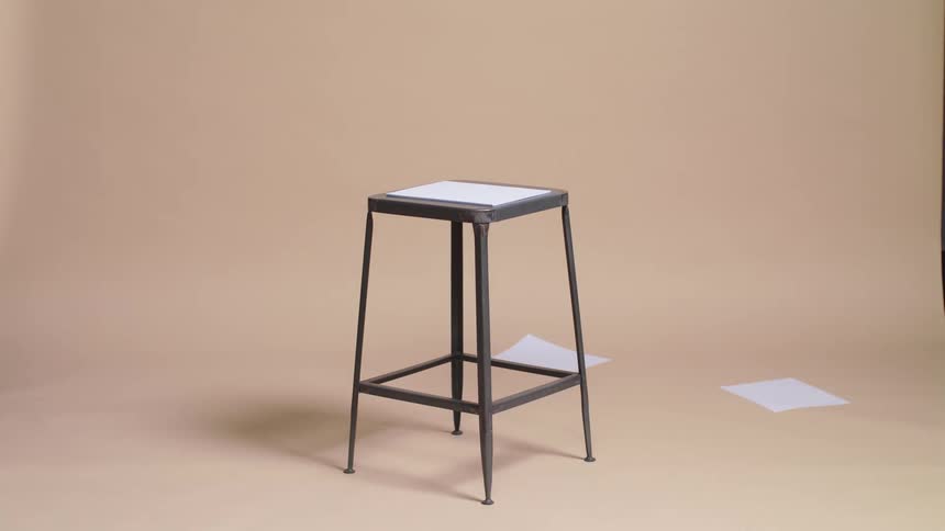 Papers blowing off a stool