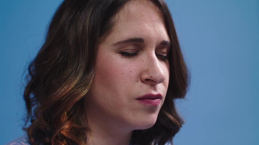 A woman with her eyes closed