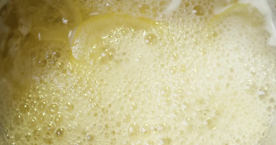 Slices of food covered in a liquid that bubbles up