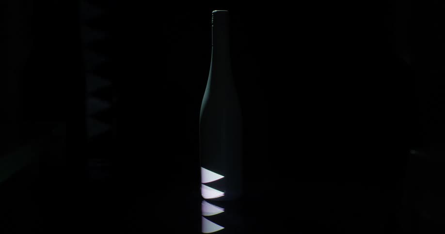 Lights flashing and lighting up on a wine bottle