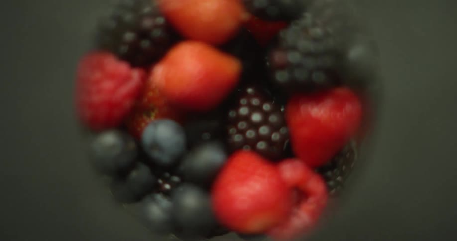 Various berries fill rotating glass container