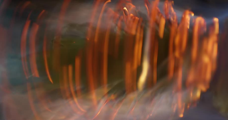 A burning pineapple spins around very quickly