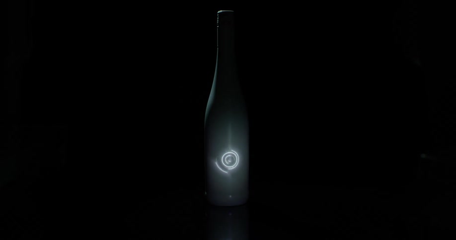 A light being projected on a bottle