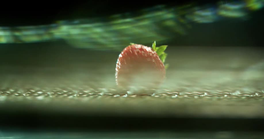 A strawberry spinning in a vortex