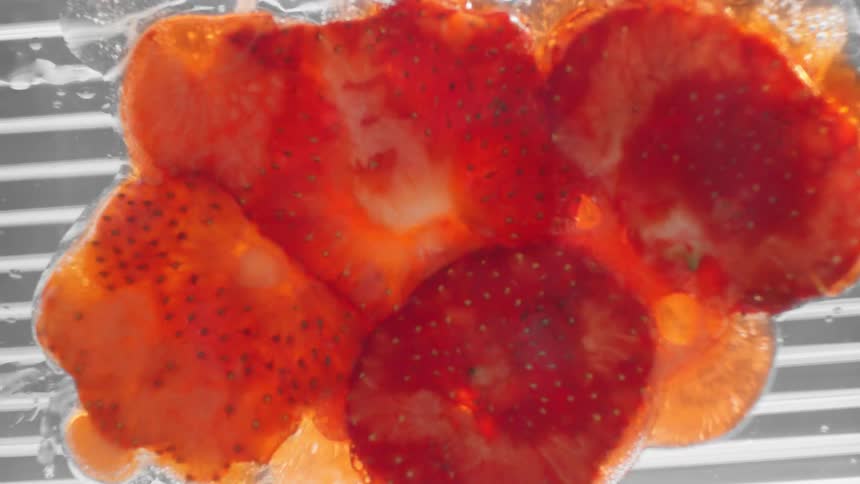 Strawberries are displayed in water