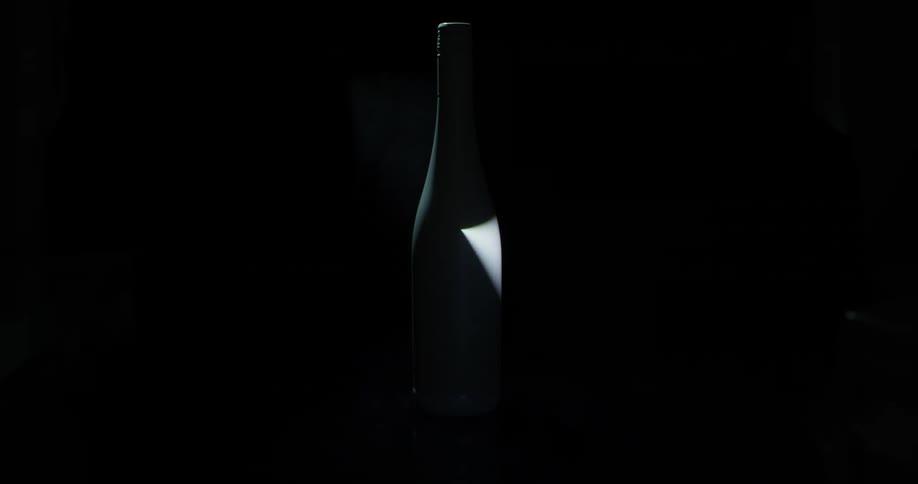 A light shines on a bottle