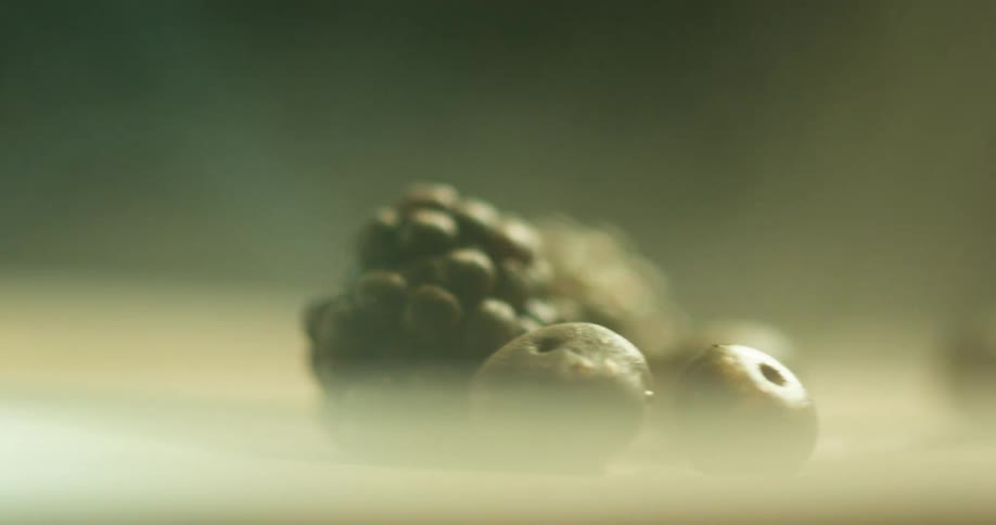 Blackberries and olives on a spinning plate
