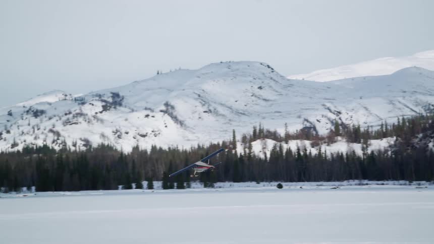 A helicopter flying in the mountains