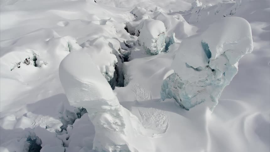 Snow and ice form in two small towers